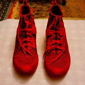 All red Puma Ignite EvoKnit running shoes